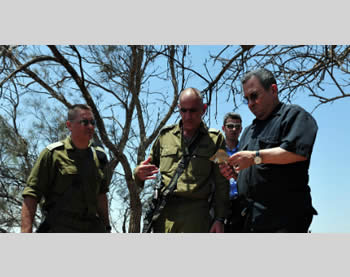 Israeli Defense Minister Ehud Barak visits the site of the attack (Picture from the Ministry of Defense, August 6, 2012).