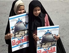 Iranian girls hold posters reading, ''Jerusalem is ours'' Picture from the FARS website, August 11, 2012).