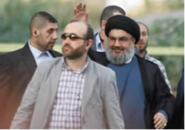 Hassan Nasrallah, surrounded by his bodyguards, arrives at Hezbollah’s protest rally in Beirut’s southern suburb (Al-Intiqad, Lebanon, September 17, 2012).