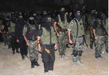 PIJ military wing operatives on a military display in the Gaza City neighborhood of Sajaiya (Jerusalem Brigades website, September 23, 2012)