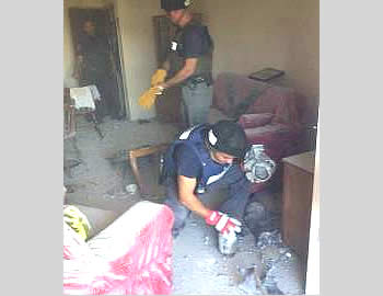 Direct rocket hit on a house in Ashqelon (Israel Police Force Facebook page, November 18, 2012).