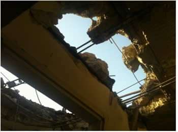 Damage to a home in Ofaqim (Sderot Media Center, November 17, 2012).