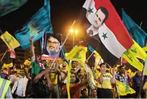 Hezbollah activists in Lebanon hold a pro-Assad rally (Ilaf website, from All4Syria, July 2011).  