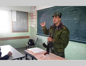 An education officer explains the structure of a Kalashnikov assault rifle to adolescents (Filastin Al-'An, December 30, 2012).