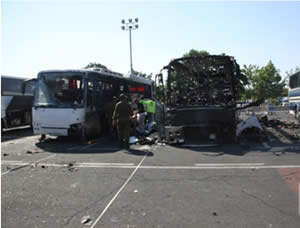 The burned-out bus at the scene of the attack at the Burgas airport (Photo courtesy of the ZAKA spokesman, July 19, 2012).