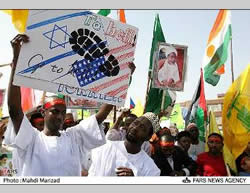 African students carrying a poster condemning Israel and the United States and waving (left) the Hezbollah flag. 