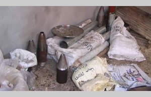 Weapons and raw materials for the manufacture of explosives found in a residential building. The bags (marked in Hebrew) contain table salt, used to manufacture explosives