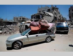 Shejaiya families return to their houses to remove possessions (Wafa.ps, August 1, 2014).