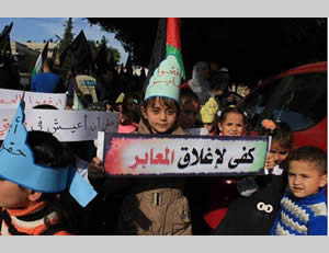 Children demonstrate in front of the UNDP building. The sign reads, 