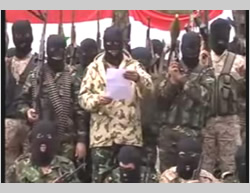 The Sunni tribes’ announcement of the establishment of the Popular Resistance Front. The Syrian flag is visible in the background (YouTube, December 27, 2014)