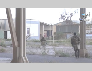 Photo from the video showing ISIS operatives moving in the refinery compound in Baiji 