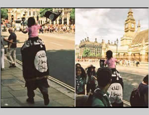 Photos of a man walking in the streets of London cloaked with a flag identified with ISIS (Twitter, July 5, 2015)