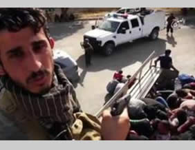 Hijazi in a video in which he and other ISIS operatives execute Iraqi Army soldiers (theshamnews.com, July 12, 2015). 