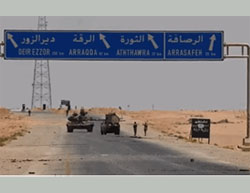 Syrian Army presence in the important Al-Rasafeh junction. On the side of the road (on the right) there is an ISIS sign that reads “There is No God but Allah - the Islamic State - Al-Raqqah Province” (SANA News Agency, June 12, 2016).