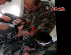 Syrian soldier injured by chemical weapons wearing an oxygen mask.  