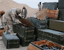 ISIS operatives examining crates of ammunition in the Russian base in Palmyra. 