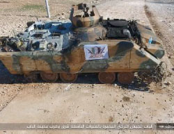 Turkish Army APC hit by an ISIS-planted IED. A Free Syrian Army flag is hanging on the APC (Haqq, February 3, 2017)