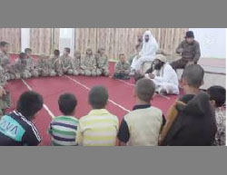 Yazidi children forcibly converted to Islam undergoing religious indoctrination by ISIS operatives. 