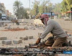 Laying sidewalks in Abu Kamal (Haqq, May 15, 2017).