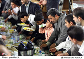 President Ahmadinejad shares fast-breaking meal with orphans