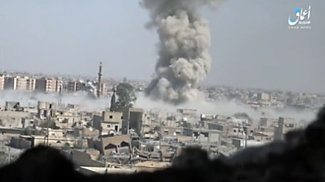 e billowing from the explosion of an ISIS car bomb, which hit a gathering of SDF forces near the Al-Barazi Square (Aamaq, 9 September 2017).