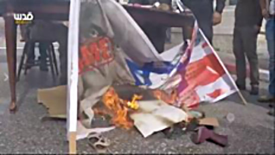 Burning the Israeli and British flags and a picture of Lord Balfour during a demonstration held at the northern entrance to Bethlehem (Facebook page of QudsN, November 1, 2017).