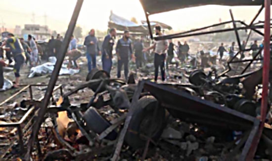 The scene of the car bomb explosion in a vegetable and fruit open market in the city of Tuz Khurmatu (Al-Jazeera, November 21, 2017)