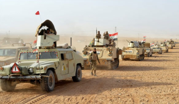 Iraqi army bullet-proof Humvees and APCs in the desert area during the mopping-up operation (Al-Baghdadia News, November 26, 2017).