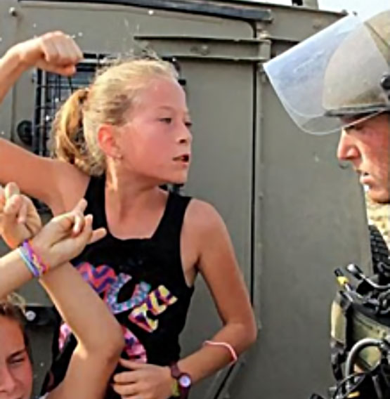 Ahed Tamimi threatens an IDF soldier (al-Anadolu News, December 30, 2012).