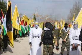 Masked terrorist operatives, some of them wearing uniforms and bullet-proof vests, some wearing white shrouds and explosive belts, carrying copies of the Qur'an. 