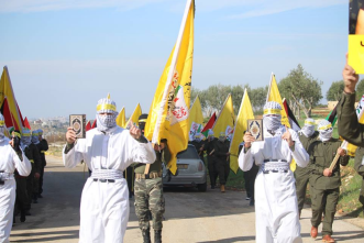 Masked operators wearing white shrouds and explosive belts. Each of them held a copy of the Qur'an (Facebook page of the Fatah student movement at Bir Zeit University, January 3, 2018).