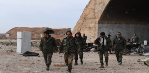 Syrian army soldiers near a hardened aircraft shelter in the Abu Ad-Duhur military airbase (SANA, January 22, 2018). 