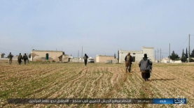 ISIS operatives moving towards the Syrian forces near Sinjar, southwest of the Abu Ad-Duhur airbase.