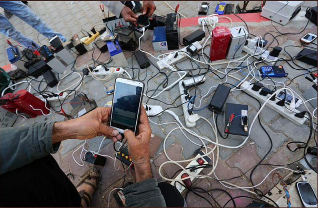 Results of the shortage of electricity: Gazans charge their phones using batteries in the street (Palinfo Twitter account, February 3, 2018).