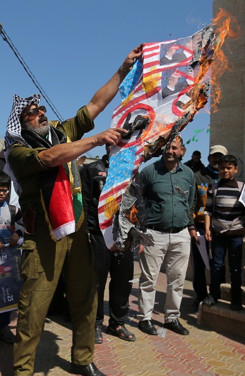 Demonstration in Rafah where American and Israeli flags and a picture of Donald Trump were burned. Swastikas were drawn on the flags (Filastin al-A'an, and Palinfo, March 7, 2017).