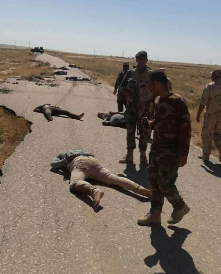 Iraqi security personnel near the bodies of the abductees who had been executed by ISIS on the Diyala-Kirkuk highway (BasNews, June 27, 2018)