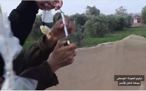 ‏‏Gazan women from the "daughters of al-Zouari unit" launch incendiary balloons at "return march" events on July 13, 2018 (Facebook page of the "supreme national authority of the return march," July 13, 2018).