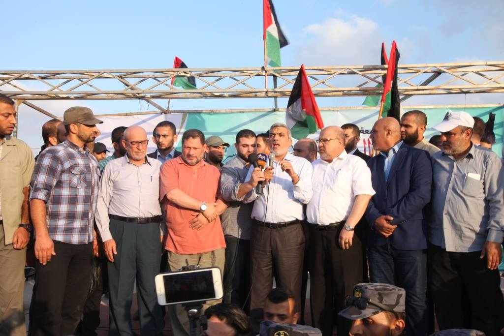 Members of Hamas' political bureau Izzat al-Rishq and Maher Abid (in the orange shirt in the picture at the left), who came with Hamas' 