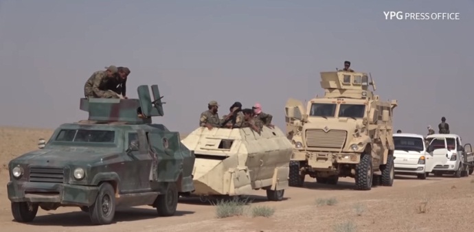 SDF vehicles traveling near the Syria-Iraq border, south of the village of Al-Dashisha, about 60 km southeast of Al-Hasakah (YPG Press Office, August 4, 2018)