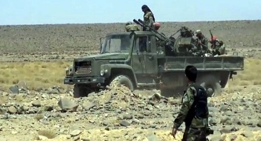 Syrian army soldiers and trucks deep inside the rocky terrain of the Al-Safa area (Syrian TV, September 11, 2018)