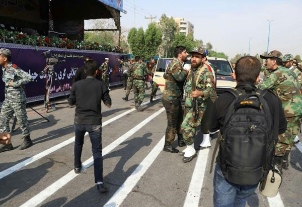 Iranian security personnel, the VIP seating and part of the route of the military parade shortly after the attack (Tasnim News Agency, September 24, 2018)