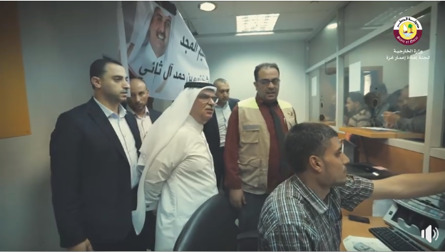 Mohammed al-Emadi, chairman of the Qatari Committee, supervises the disbursement of funds at post office branches in the Gaza Strip (Facebook page of the Qatari Committee, November 9, 2018).