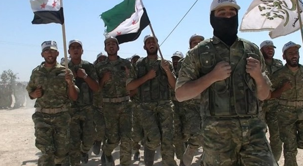 Jaysh al-Izzah operatives waving the organization flag (right) and Free Syrian Army flags (center and left) (Al-Mayadeen, November 9, 2018)