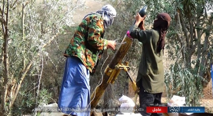 ISIS operatives firing a 120mm mortar shell at Syrian army positions on the west bank of the Euphrates, north of Albukamal (ISIS’s Al-Barakah Province, November 9, 2018).