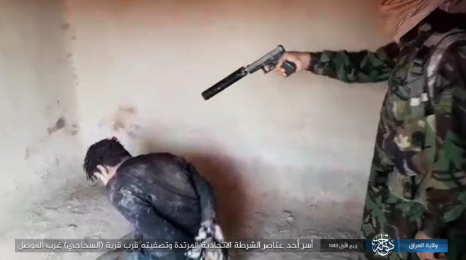 The execution of the member of the Federal Police ISIS’s Iraq – Dijla Province, Iraq, November 11, 2018)