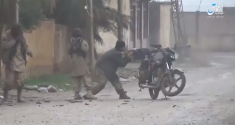 ISIS operative firing a heavy machine gun mounted on a motorcycle (Amaq, December 17, 2018)