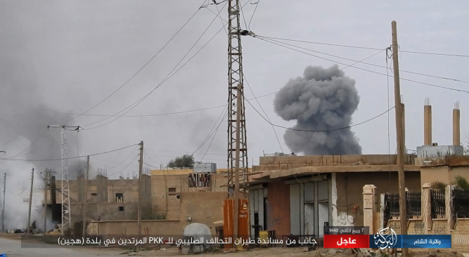 Smoke rising after a Coalition airstrike in the city of Hajin. 