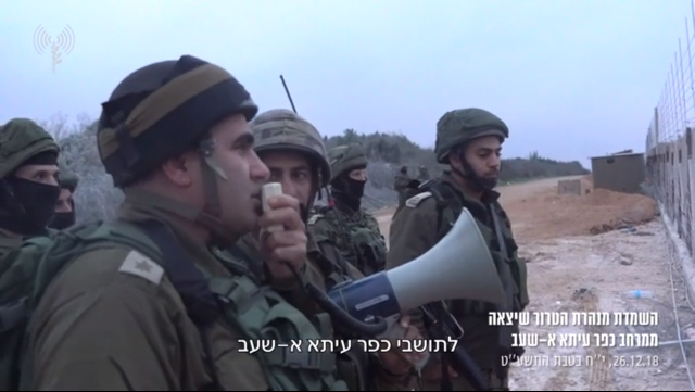 IDF soldiers call on the residents of the Shi'ite village of Ayta al-Shab to evacuate the area before the Hezbollah attack tunnel is blown up.