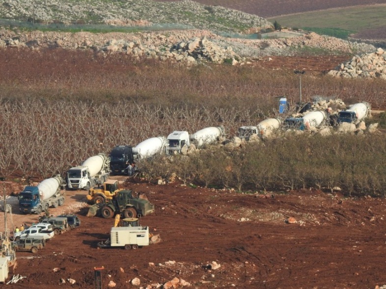 Cement mixers en route to the border fence opposite Kafr Kila (Ali Shoeib's Twitter account, December 25, 2018).