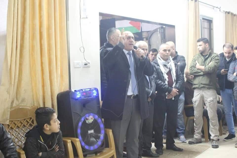 Jenin district governor Akram Rajoub (black coat, gray tie) at the event held at the home of the Jarar clan (Facebook page of Musab Zyoud, journalist from Jenin, January 21, 2019).